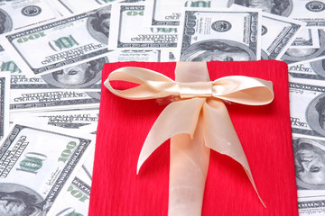 heap of dollars with red gift
