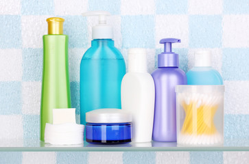 Obraz na płótnie Canvas Shelf with cosmetics and toiletries in bathroom