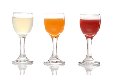 Tropical juices in glasses isolated on white