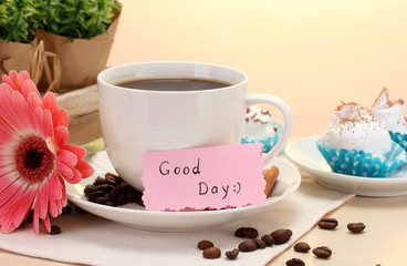 cup of coffee and gerbera beans, cinnamon sticks on wooden