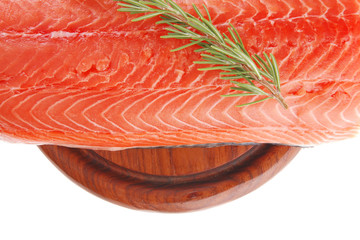 raw salmon fillet on wood and rosemary