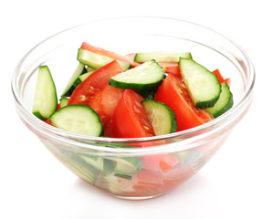Fresh salad with tomatoes and cucumbers isolated on white