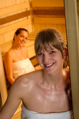 Obraz na płótnie Canvas Woman posing at sauna in health spa
