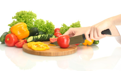 woman hands cutting vegetables on kitchen blackboard