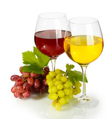 glasses of wine and ripe grapes isolated on white