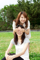 Beautiful young woman in the park. Portrait of asian.