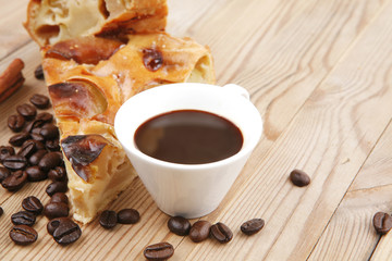 sweet round apple pie on wood with coffee cup
