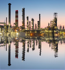 Oil and gas refinery with reflection in water