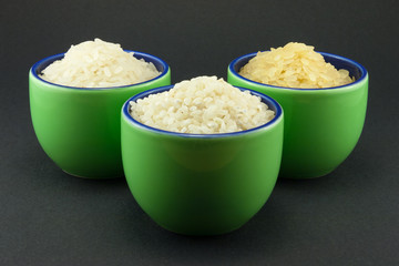 Three varieties of rice in three small green cups