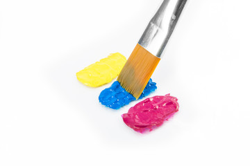 Yellow, cyan and magenta colors with paintbrush