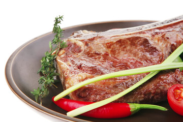 savory : roasted beef spare rib on dark dish with pepper