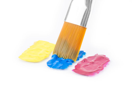 Yellow, cyan and magenta colors with paintbrush