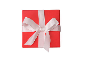 A red gift with a white ribbon and a bow