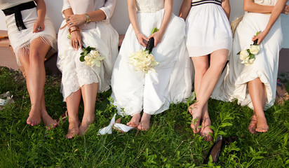 Bride and bridesmaids legs - obrazy, fototapety, plakaty