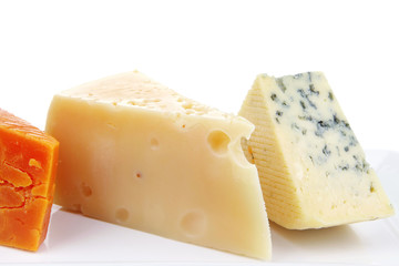 blue stilton roquefort with orange cheddar and yellow parmesan