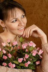 Obraz na płótnie Canvas Beautiful Caucasian woman with a flower
