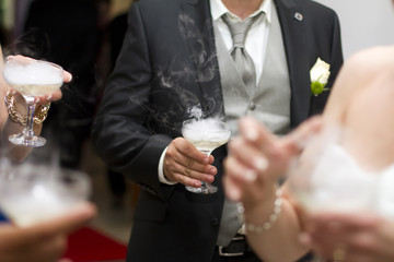 people cheering each other with cocktail