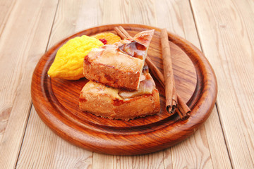 apple cake served with lemon and cinnamon