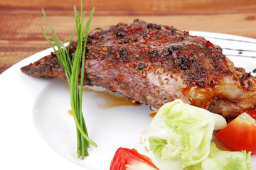 on wooden plate : roast shoulder