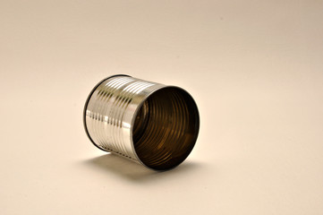 Tin can on laying on it's side.
