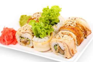 Tasty rolls served on white plate isolated on white