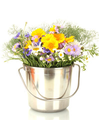 beautiful bouquet of bright  wildflowers in bucket, isolated