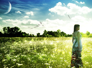 Fototapeta premium Summer time on the meadow. Abstract female portrait