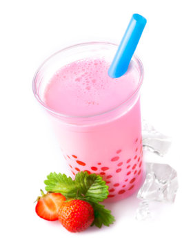 Glass of frothy strawberry bubble tea