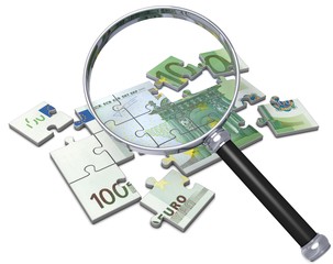 Geld Puzzle mit Lupe