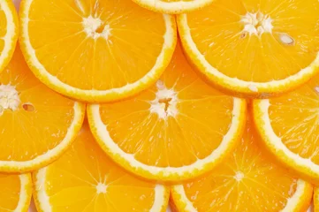 Selbstklebende Fototapeten Geschnittene Orangen Hintergrund © zhekos