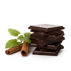 Chocolate bars stack and cinnamon sticks