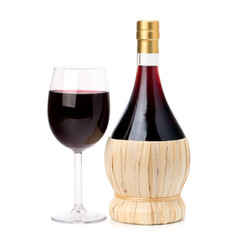 Full red wine glass goblet and bottle