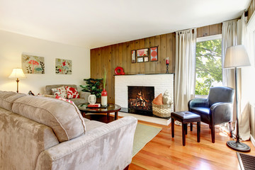 Artistic beautiful living room with fireplace and wood wall.