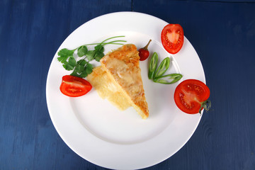 Fototapeta na wymiar casserole triangle on white plate