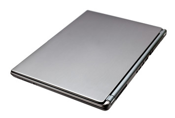 Closed notebook computer on white background
