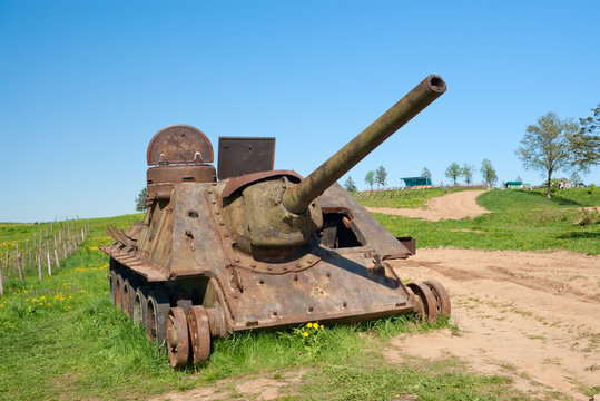 Abandoned SU-100 artillery unit with radiation hazard sign