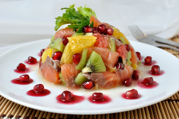 Fruit salad with salmon and pomegranate