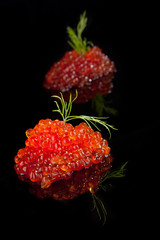 Caviar isolated on black.
