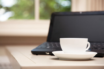 Fototapeta premium Laptop and a cup of coffee
