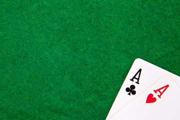Texas holdem pocket aces on casino table with copy space
