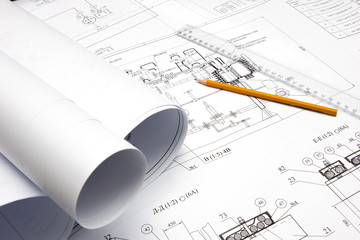pencil and ruler against the unpacked drawing