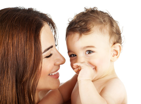 Adorable baby boy smiling with mother