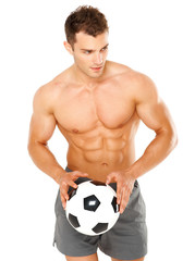 Handsome man holding soccer ball on white