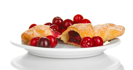 white plate with croissant and cherry isolated on white