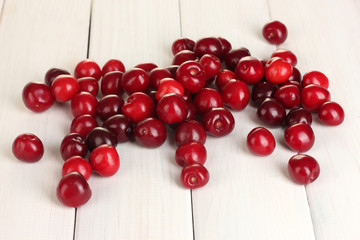 fresh cherry on white wooden table close-up