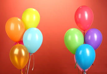 colorful balloons on red background