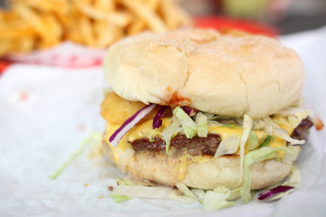 Burger and french fries in a basket.