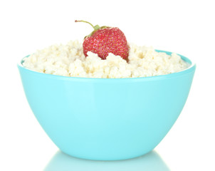 cottage cheese with strawberry in blue bowl isolated on white