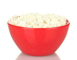 cottage cheese in red bowl isolated on white