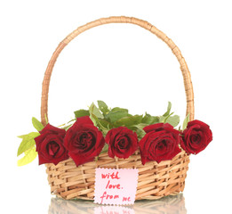 Fototapeta na wymiar Basket with roses and a note isolated
